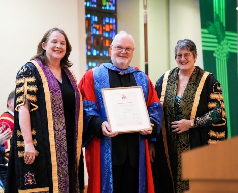 Fr Denis Blackledge collects his Senior Fellowship from Liverpool Hope University Chancellor, Professor Monica Grady and Interim Vice-Chancellor, Dr Penny Haughan.
